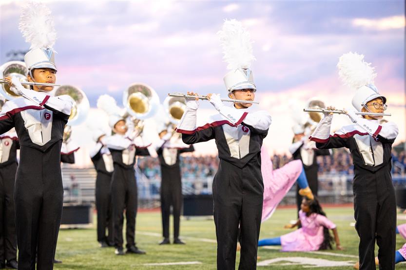 Students perform on football field